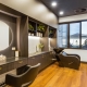 Samford Grove's hair and beauty salon with wooden floor boards and a dark, modern theme.