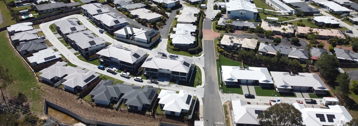 Aerial image of completed Samford Grove community with villas, townhouses and apartments now complete.